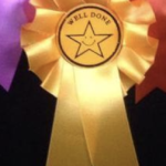 Smiley star well done rosettes