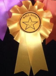 Smiley star well done rosettes